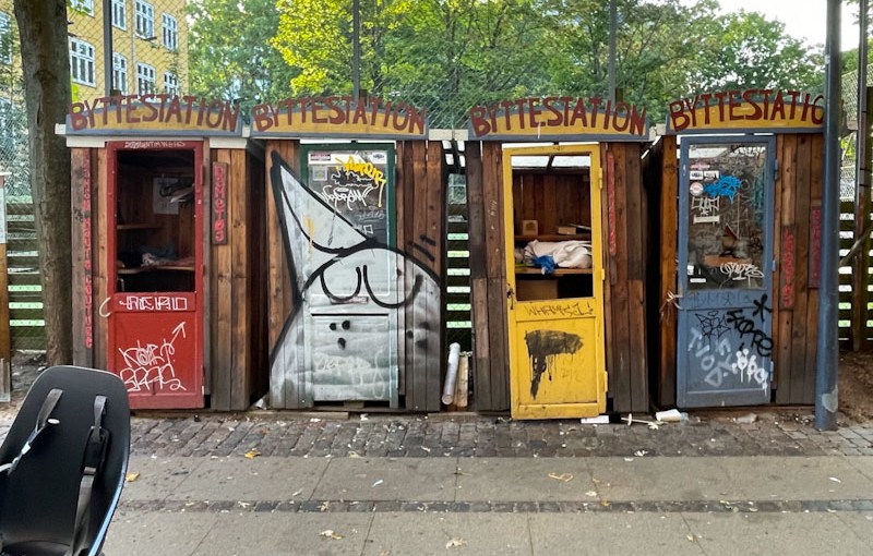 Community sharing spaces with rather tatty doors, Wesselsgade, Copenhagen, Denmark, September 2024