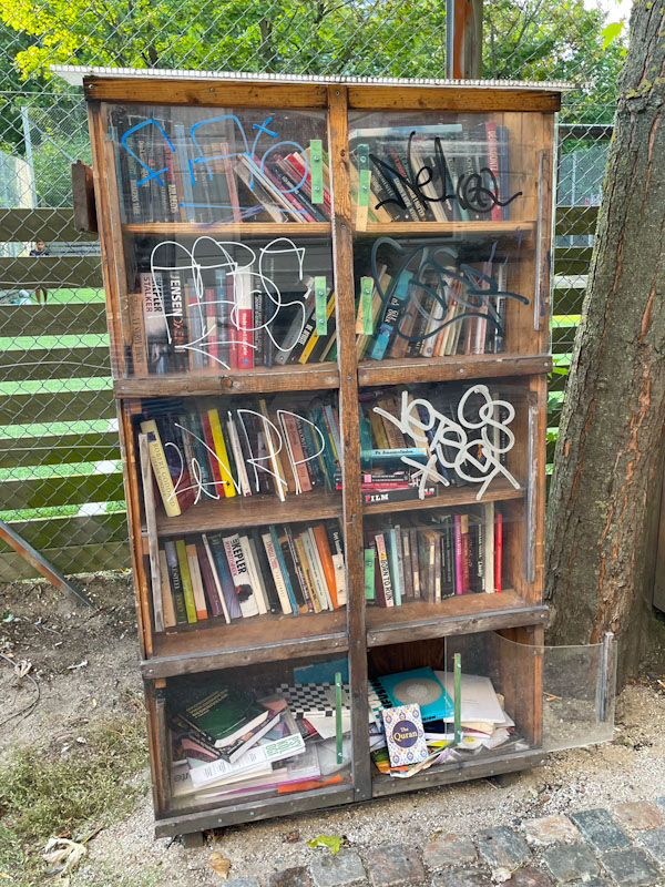 Street library with glass doors, Wesselsgade, Copenhagen, Denmark, September 2024