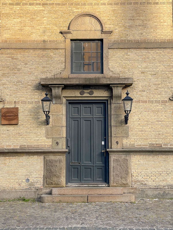 Beautifully framed door with window above, Ewaldsgade, Copenhagen, Denmark, September 2024