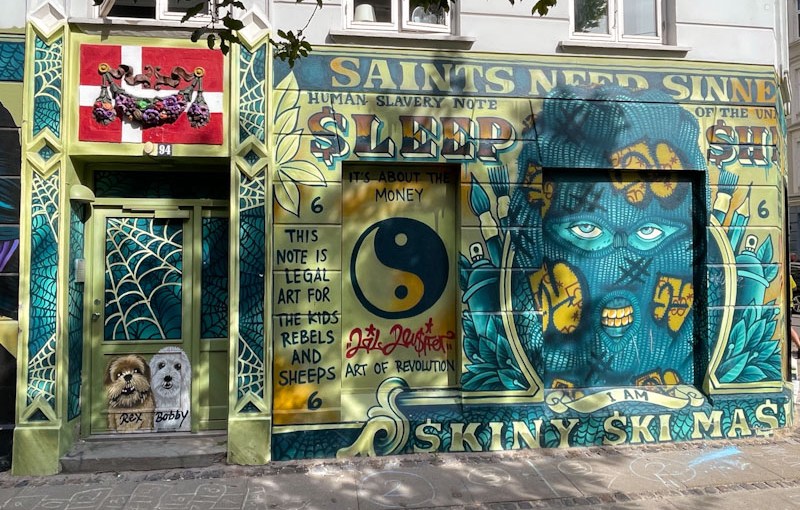 Shopfront mural and doors, Estlandsgade, Copenhagen, Denmark, September 2024