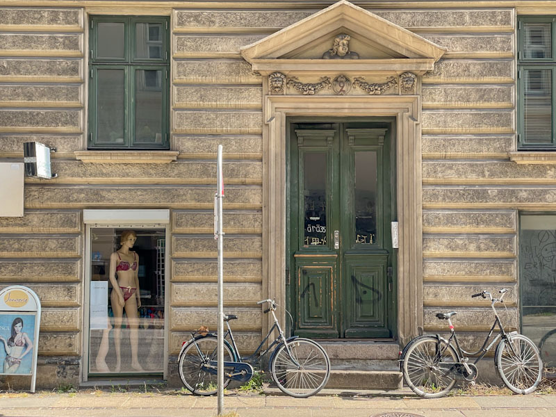 Green doors, bicycles and a sassy onlooker, Kingosgade, Copenhagen, Denmark, September 2024