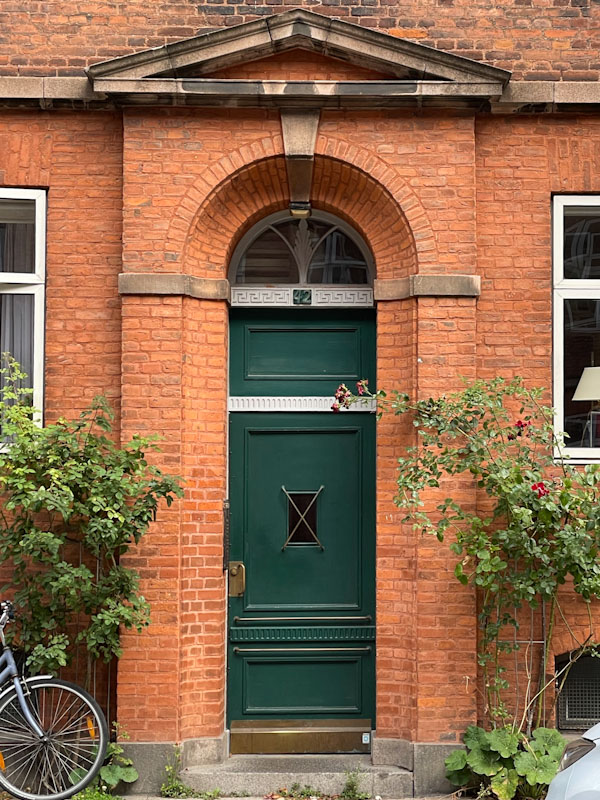 Unusual green door and beautiful bricks, Struenseegade, Copenhagen, Denmark, September 2024