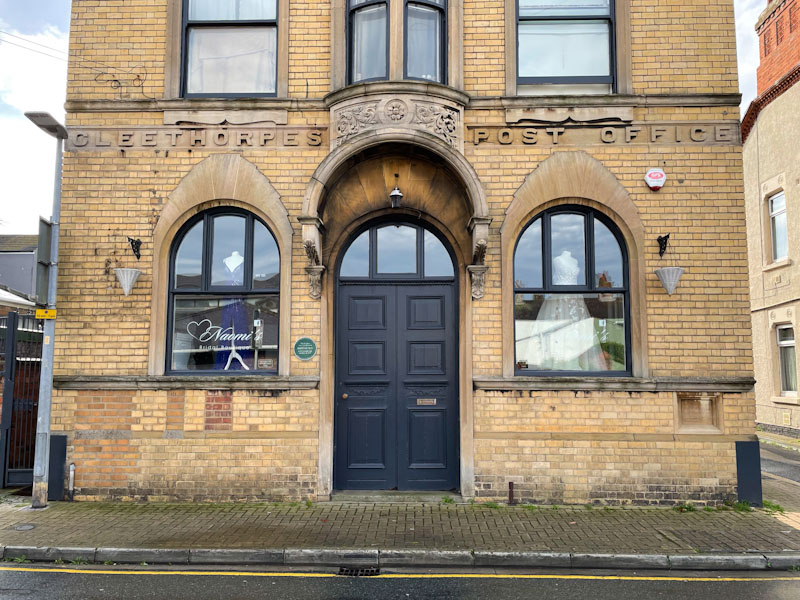 Door and fine doorway to the re-purposed Cleethorpes Post Office, Cleethorpes, England, September 2023