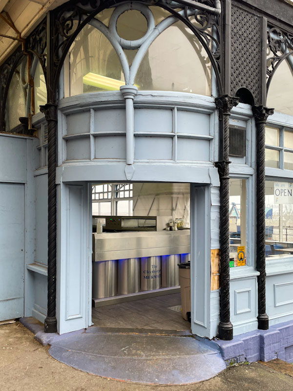 Doorway into the Mermaid fish and chips restaurant, Cleethorpes, England, September 2023