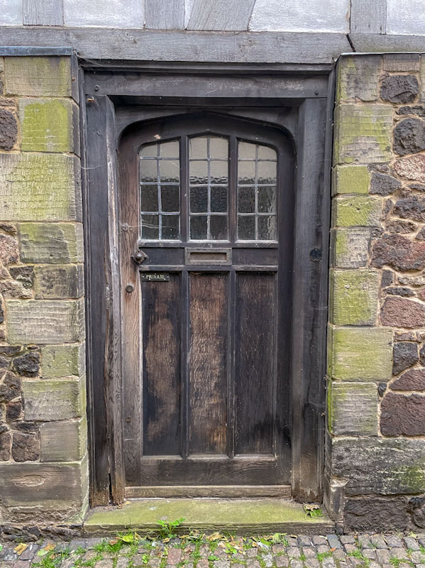 Old wooden door and glass panels, Leicester, Leicestershire, May 2024