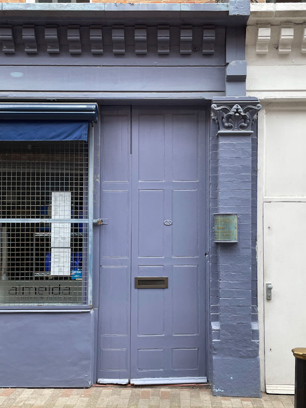 Grey door with interesting panelling, Leicester, May 2024