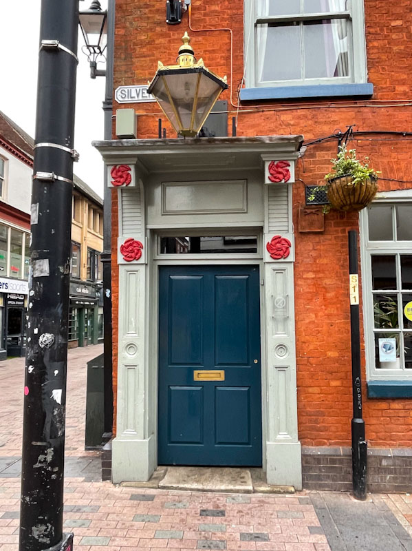 Ornate door and large lamp, Leicester, May 2024