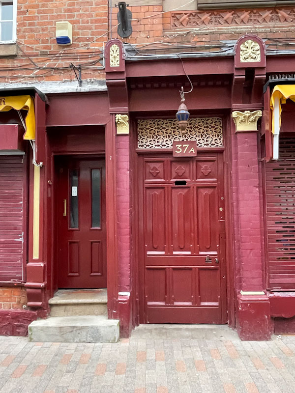Sumptuous deep red doors, Leicester, May 2024