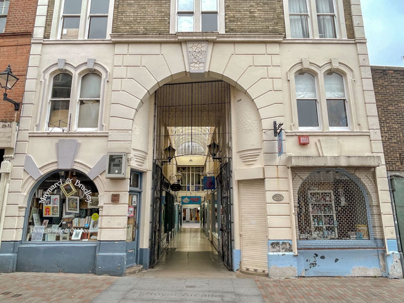 Entrance to Royal Arcade, with doors aplenty, Leicester, May 2024