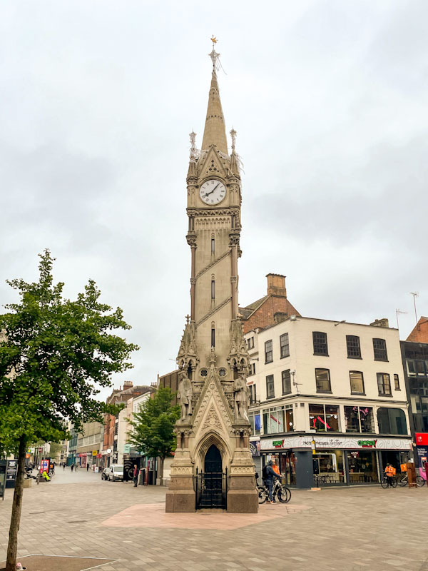 Haymarket memorial clock tower with gated arches, Leicester, May 2024