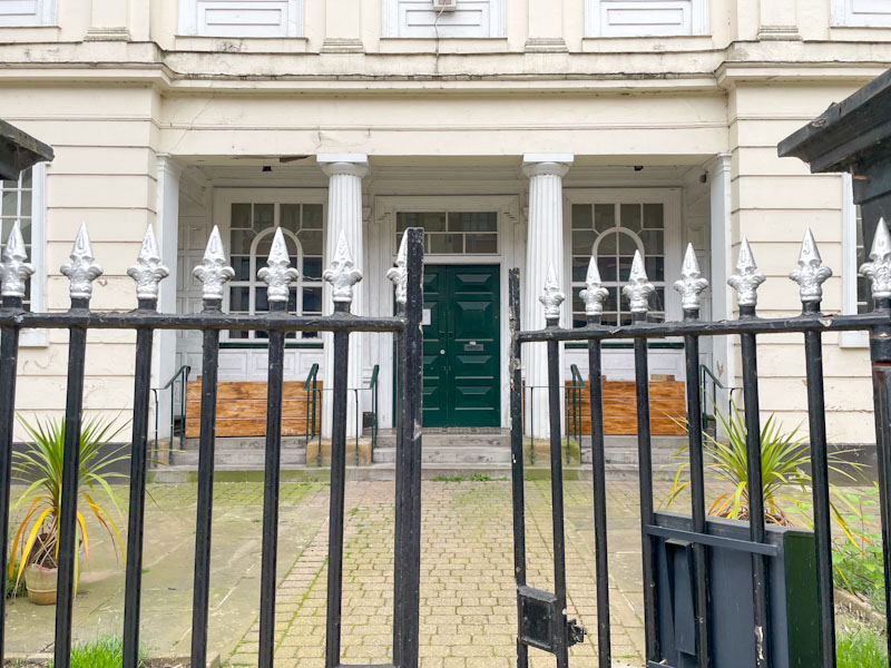 Gate and black door, Leicester, Leicestershire, May 2024