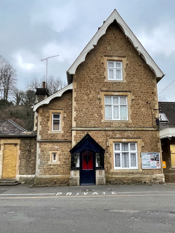 Station building and black door, Godalming, Surrey, March 2025