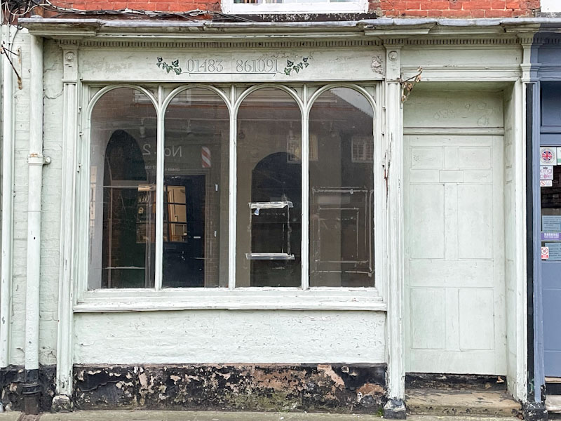 Sealed door and shopfront to Pavilion (no more), Black door and attractive surround, Church Street, Godalming, Surrey, March 2025