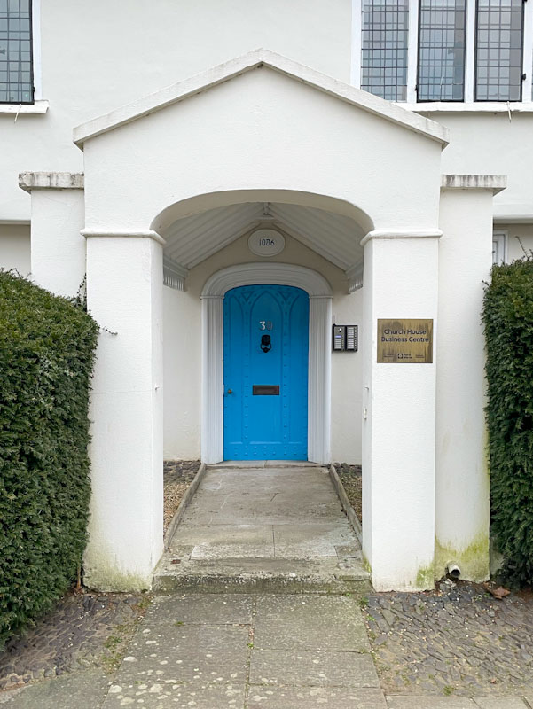Blue door and covered passage, Church Street, Godalming, March 2025