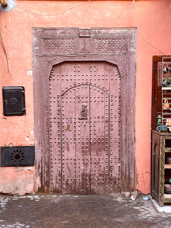 Studded wooden door and decorative surround, Bab Agnou, Marrakesh, Morocco, January 2025