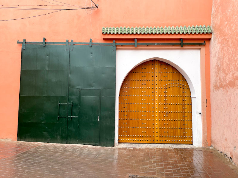 Large arched door and sliding door cover, Tariq Sahrij Gnaoua, Marrakesh, Morocco, January 2025