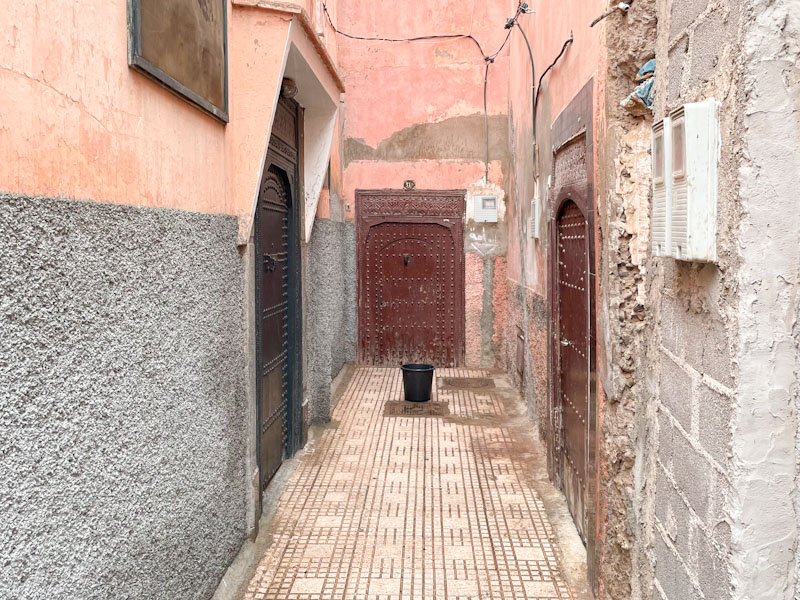 Three studded doors in a side alley, Tariq Sahrij Gnaoua, Marrakesh, Morocco, January 2025