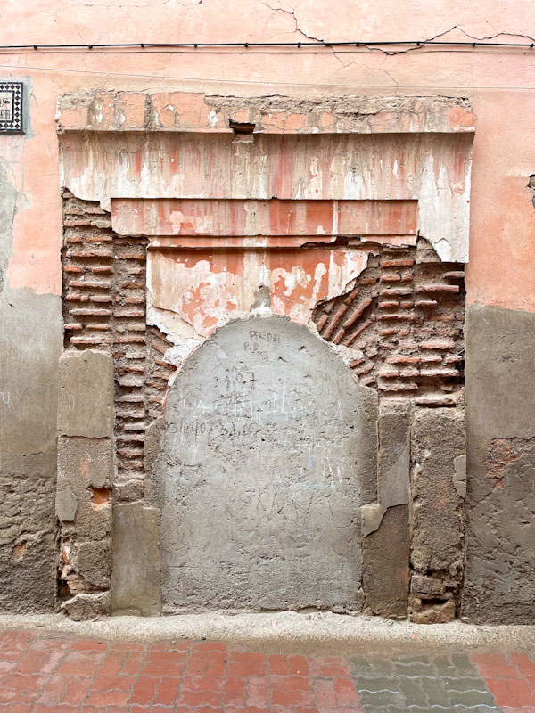 Concreted ghost door with brickwork exposed, perhaps a casualty of the earthquake, Tariq Sahrij Gnaoua, Marrakesh, Morocco, January 2025