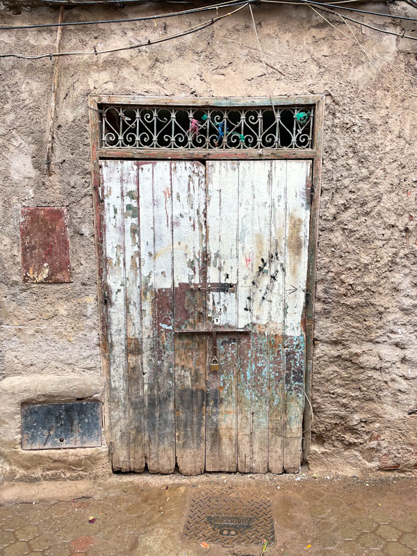 Characterful wooden door, Derb Souikt Lahaj Abdellah, Marrakesh, Morocco, January 2025