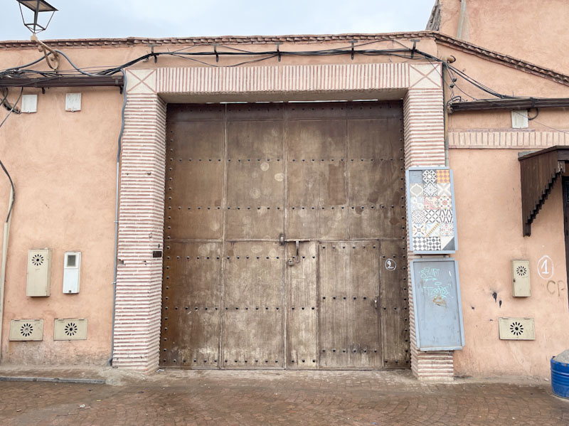 Door within an industrial gate, Route Sidi Boudchich, Marrakesh, Morocco, January 2025