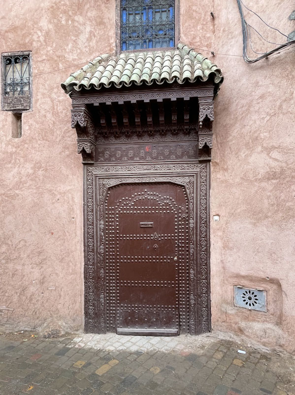 Studded door and ornate surround, Rue Douar Graoua, Marrakesh, Morocco, January 2025