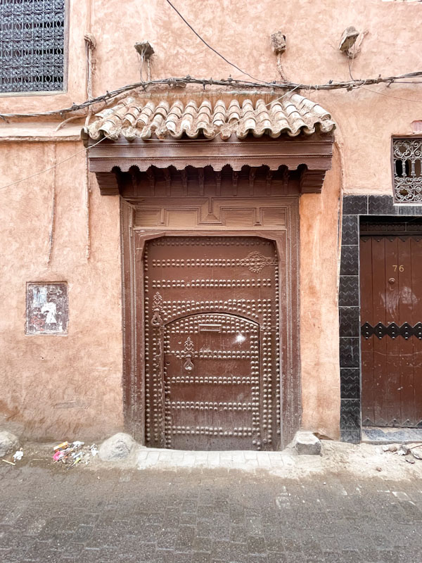 Studded door within a door, Rue Douar Graoua, Marrakesh, Morocco, January 2025