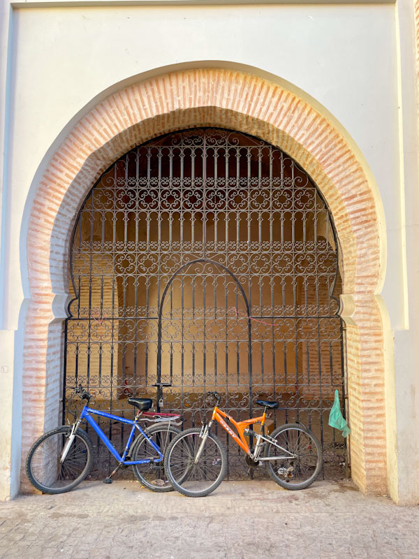 Gated archway and bicycles, Mouassine fountain, Derb Mouassine, Marrakesh, Morocco, January 2025