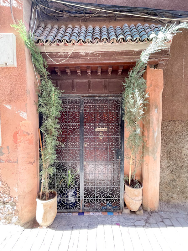 Wide-angle shot of pots, gates and a door, Rue De La Bahia, Marrakesh, January 2025