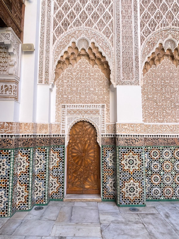 Door, tiles and plaster work, Madrassa Ben Youssef, Marrakesh, Morocco, January 2025