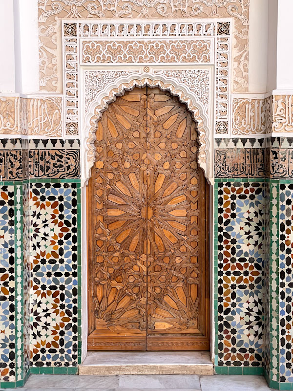 Door, tiles and plaster work, Madrassa Ben Youssef, Marrakesh, Morocco, January 2025