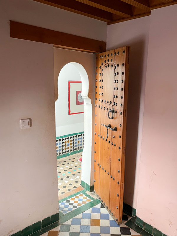 Door from one of the dormitory rooms to the landing, Madrassa Ben Youssef, Marrakesh, Morocco, January 2025
