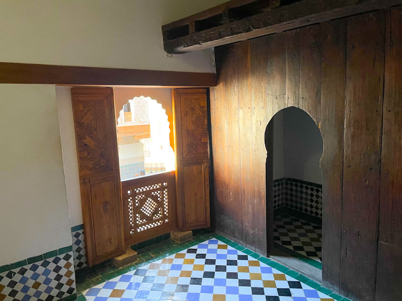 Small dormitory/cell window and doorway to sleeping quarters, Madrassa Ben Youssef, Marrakesh, Morocco, January 2025