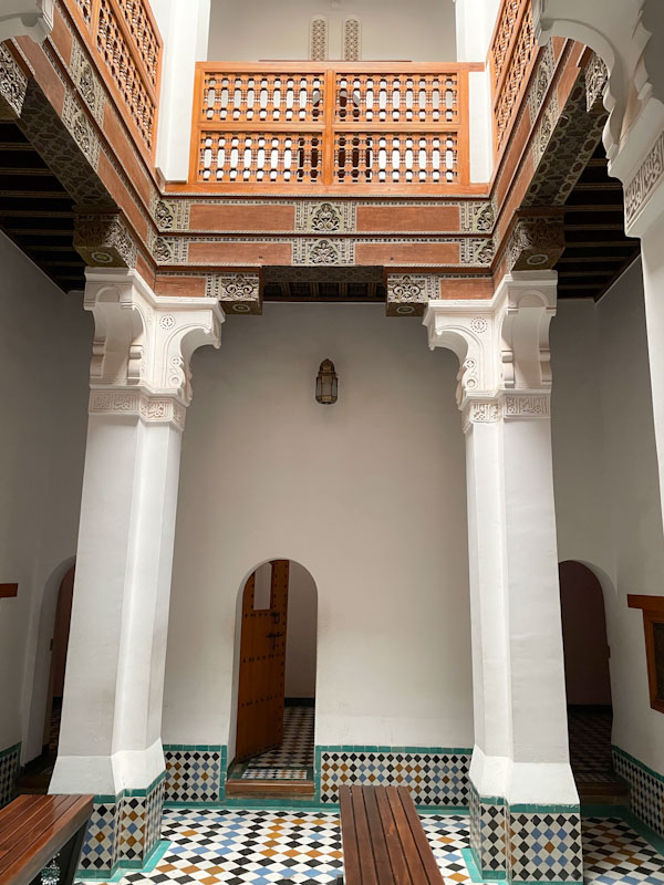 Doors in a hallway and small courtyard, Madrassa Ben Youssef, Marrakesh, Morocco, January 2025