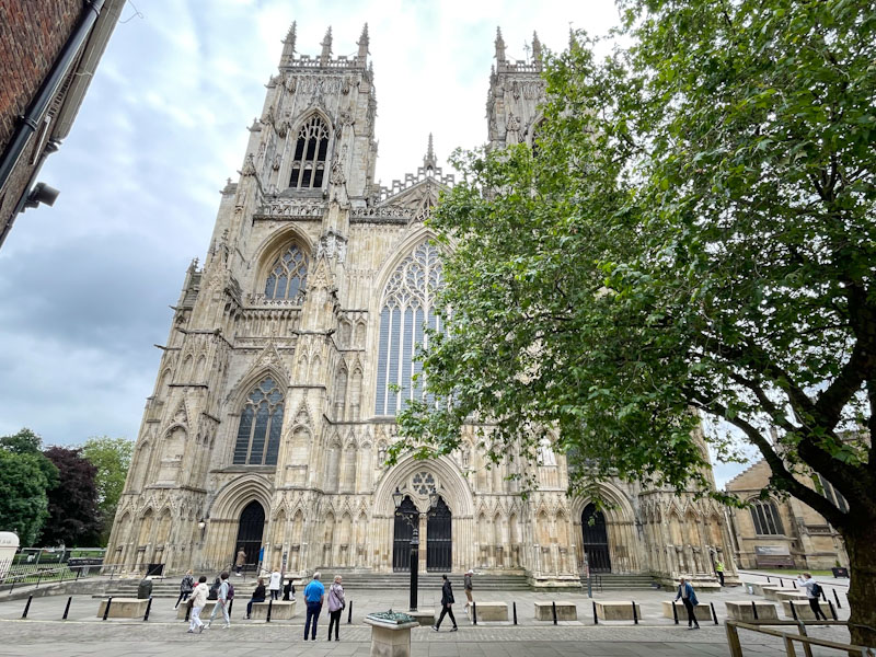 West front of York Minster with three entrances, York, North Yorkshire, June 2024