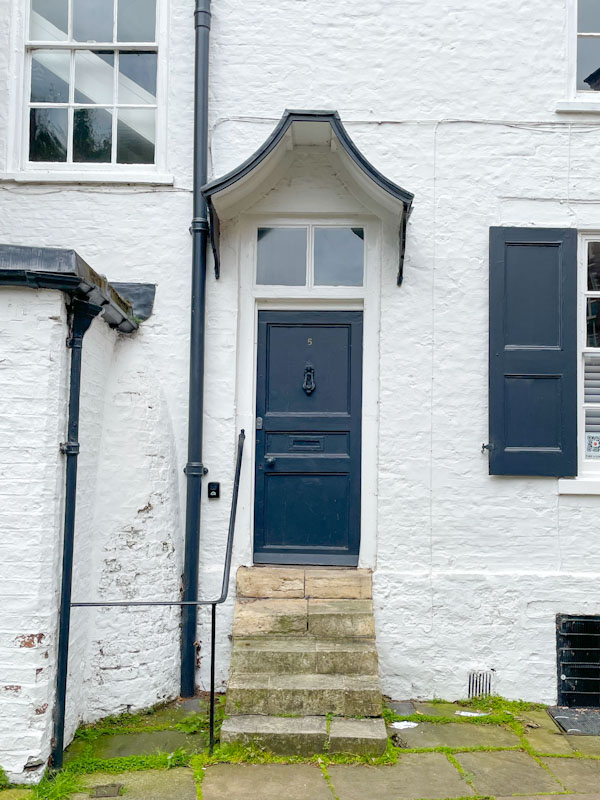 Black door, steps and awning, Your, North Yorkshire, June 2024