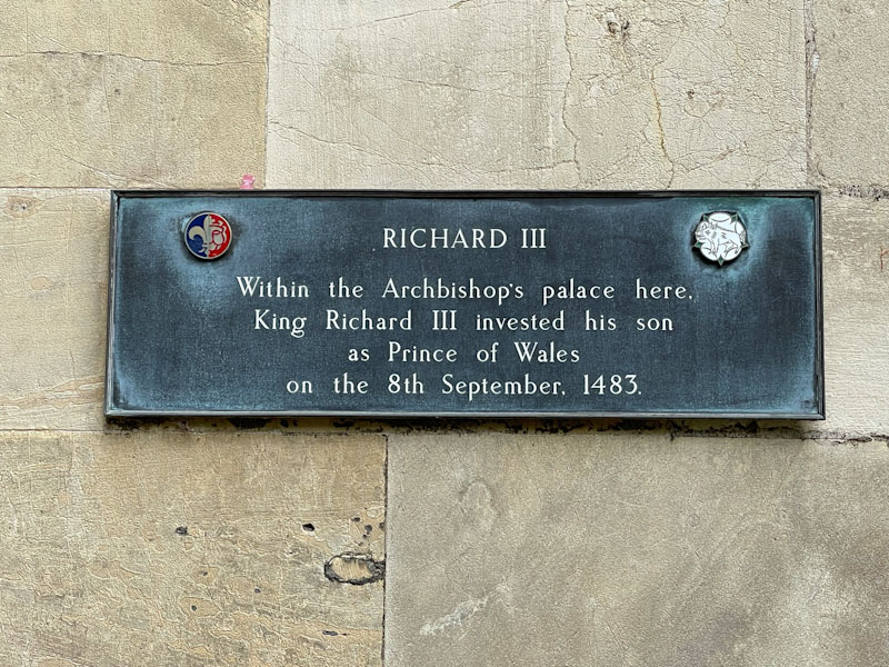 Plaque next to the door of Minster Library, York, North Yorkshire, June 2024