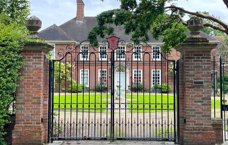 Gates and door to beautiful house, York, North Yorkshire, June 2024