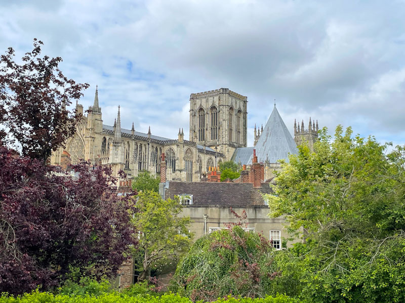 View of York Minster from the city wall, York, North Yorkshire, June 2024
