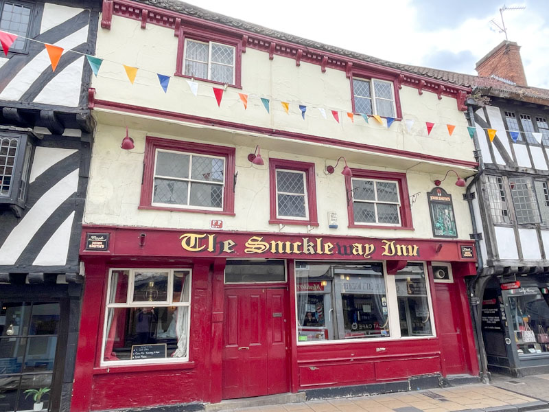 The Snickleway Inn with its distinctive red door, Goodramgate, York, North Yorkshire, June 2024