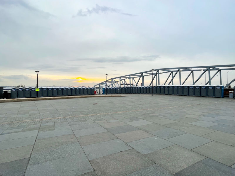 Portaloos for the runners - lots of doors, George's Dock Gates, Liverpool, March 2025