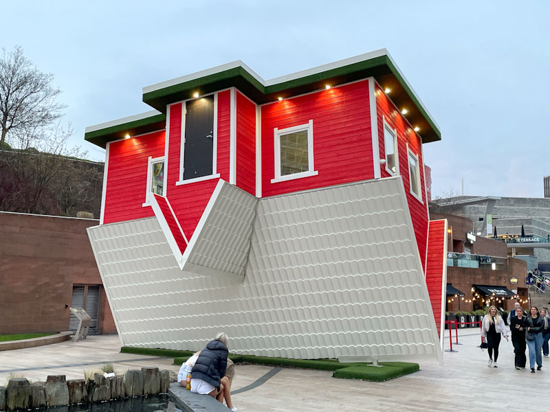 Tourist attraction upside down house with door at the top, Thomas Steers Way, Liverpool, March 2025