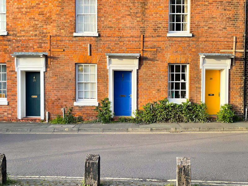 Blue and yellow doors in the evening sun, Hill's Lane, Shrewsbury, Shropshire, England, April 2025