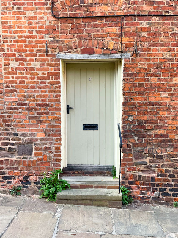 Town house door and several adjustments over time judging from the brickwork, Claremont Hill, Shrewsbury, Shropshire, April 2025