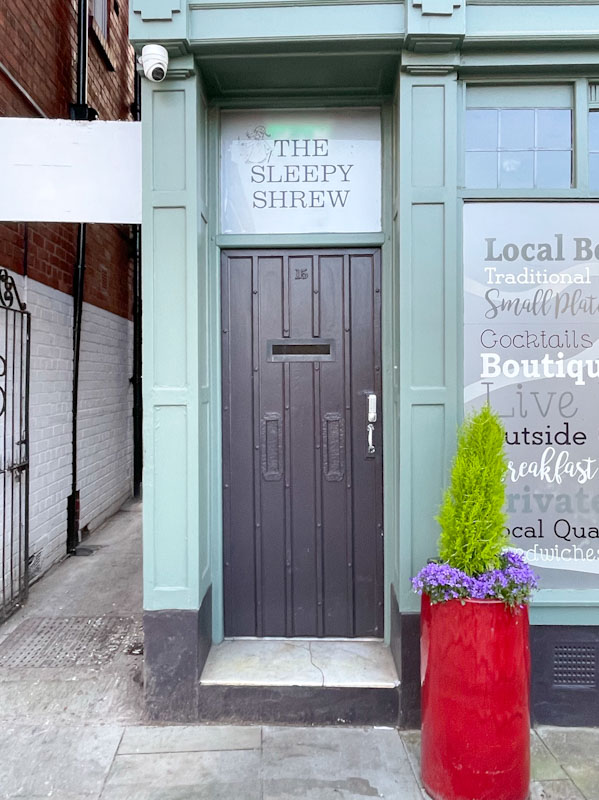 The Sleepy Shrew door with three letterboxes, Barker Street, Shrewsbury, Shropshire, April 2025
