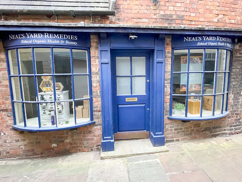 Blue door with two glass bay windows, High Street, Shrewsbury, Shropshire, England, April 2025