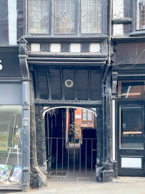 Ancient gateway with wooden surround, Wyle Cop, Shrewsbury, Shropshire, England, April 2025