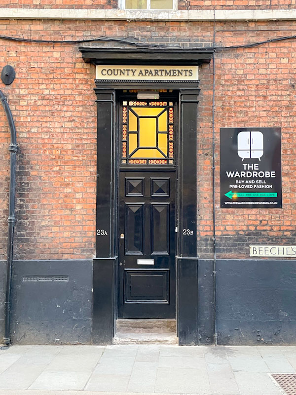 Black door and large decorative window above, Beeches Lane, Shrewsbury, Shropshire, England, April 2025