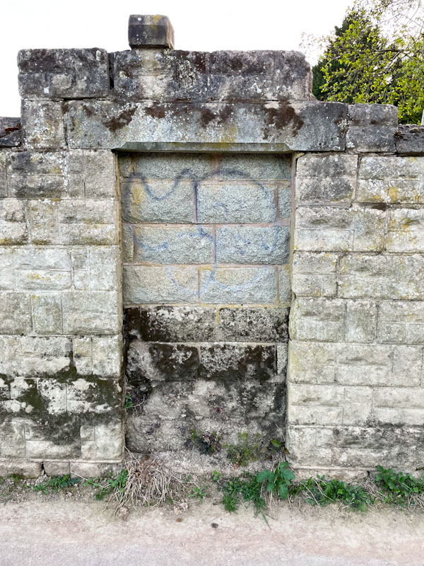 Ghost door in a wall alongside the River Severn, Shrewsbury, Shropshire, England, April 2025