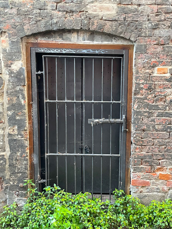 Secure door and locked gate, Saint Mary's Water Lane, Shrewsbury, Shropshire, England, April 2025