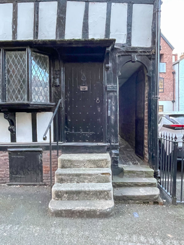 Steps up to a black studded door, Saint Mary’s Place, Shrewsbury, Shropshire, England